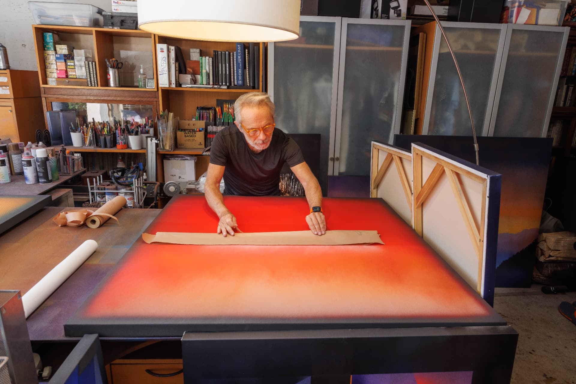 Jorge Engel working over a red painting in his Napa studio