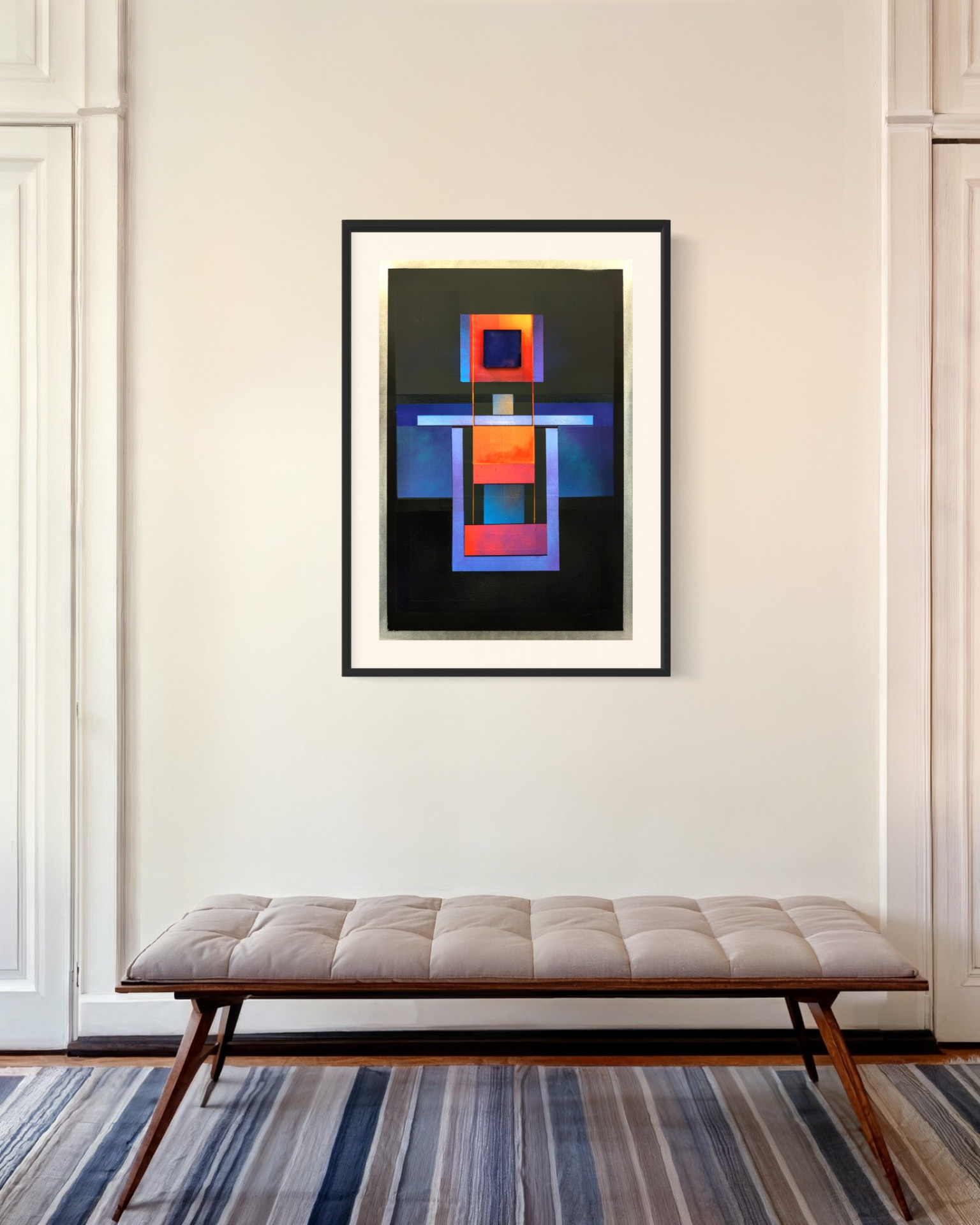 Jorge Engel artwork placed above a bench in a residential interior